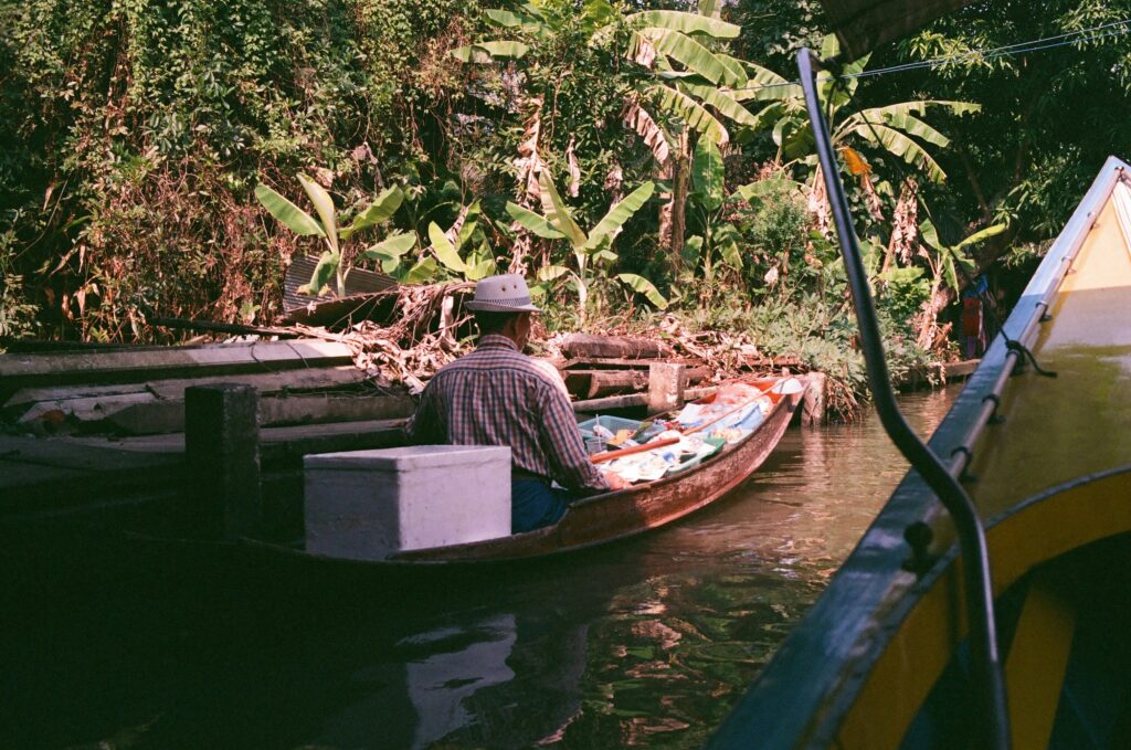 Thailand floating market travel scene for traveler diarrhea treatment planning
