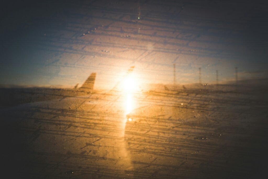 View from an airplane window at sunset.