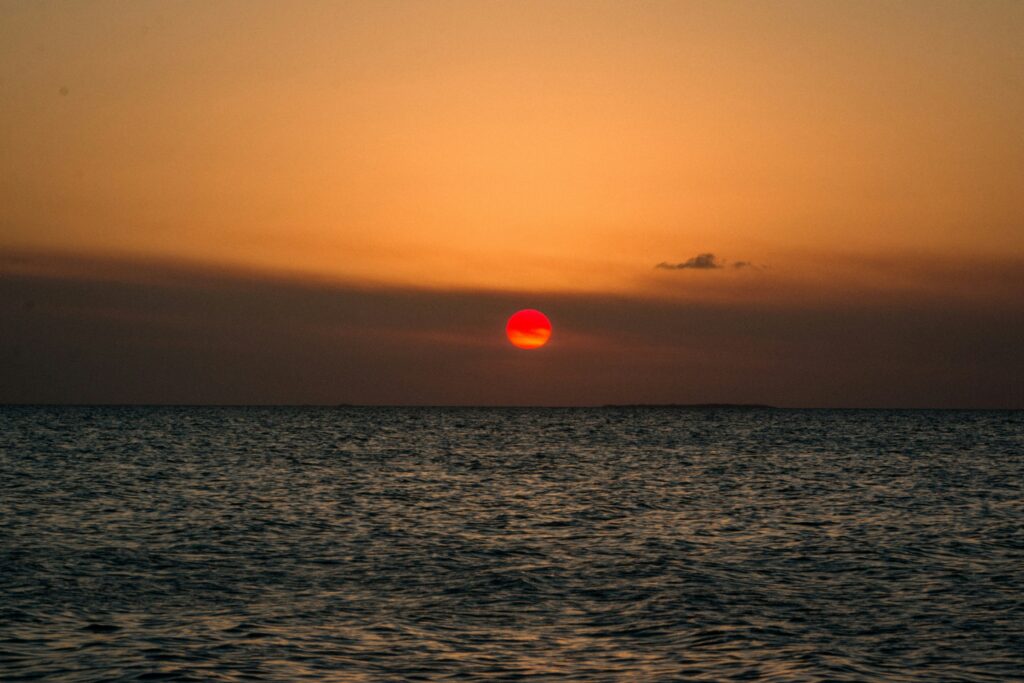 Belize beach at golden hour for traveler’s diarrhea in Belize guide