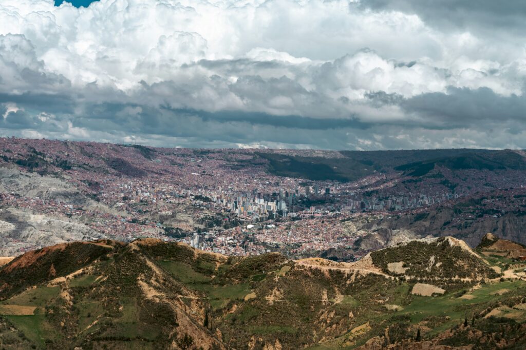 Bolivia travel health plan featured image showing La Paz and surrounding mountains
