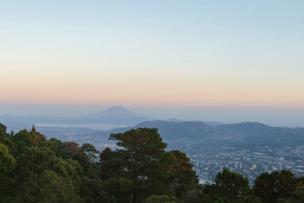 El Salvador travel clinic guide featured image showing volcanic landscape at sunset
