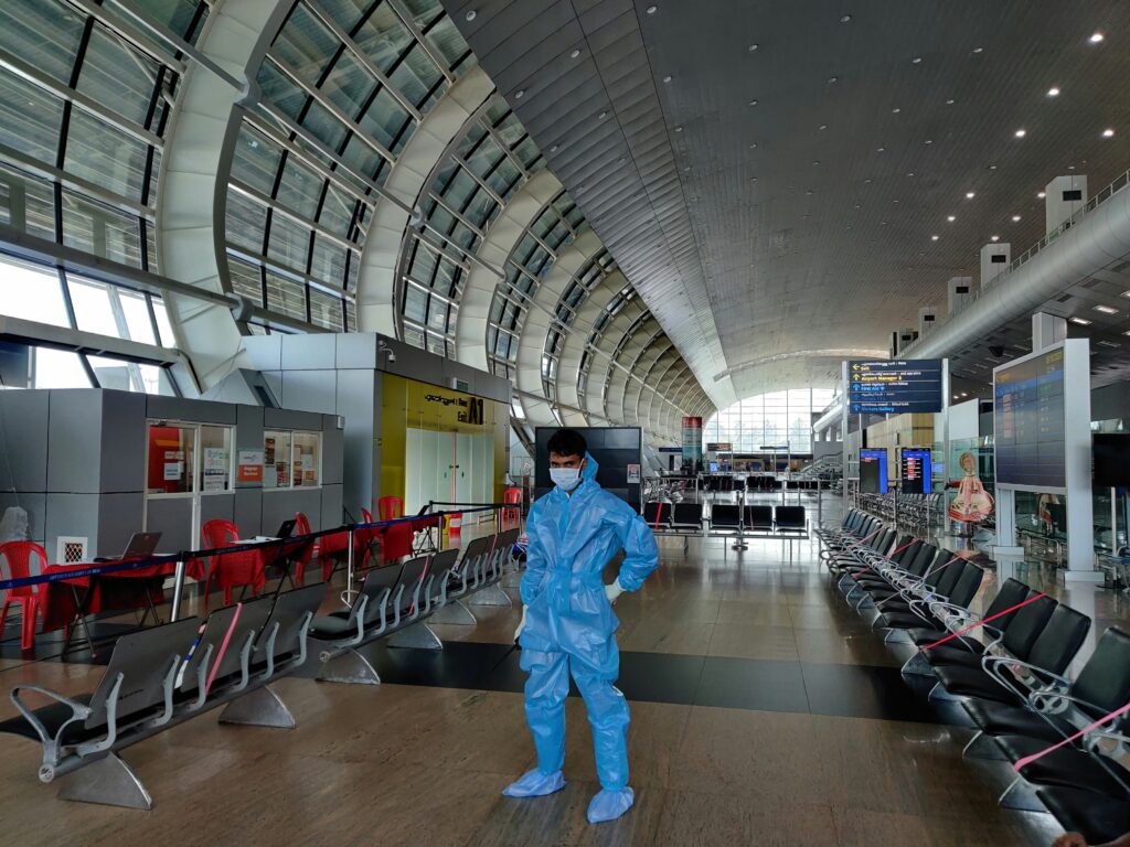 Traveler in airport wearing protective mask