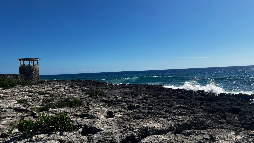 Rocky Jamaica coastline with waves crashing near Negril
