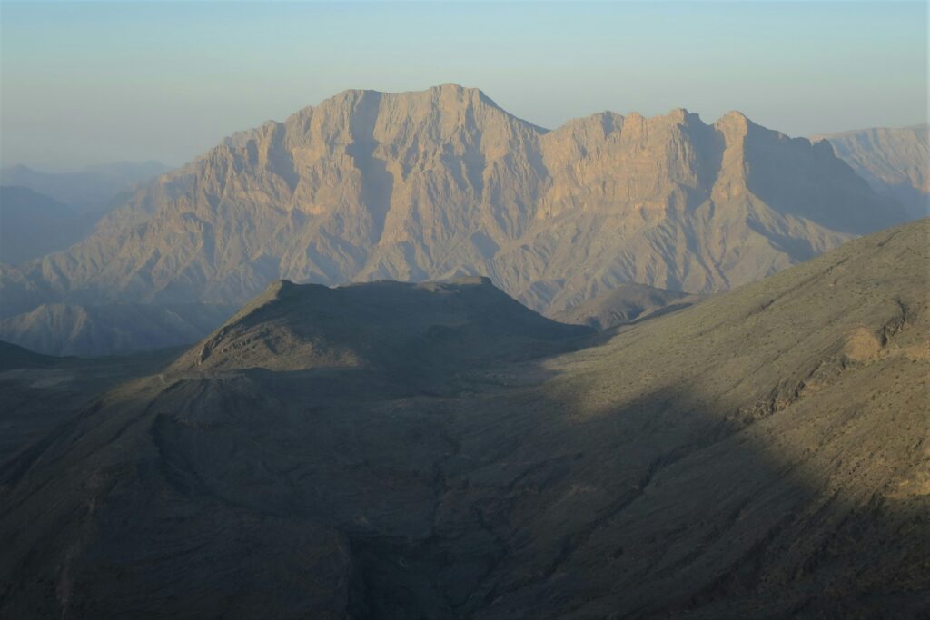 Oman travel health guide featured image showing desert mountains