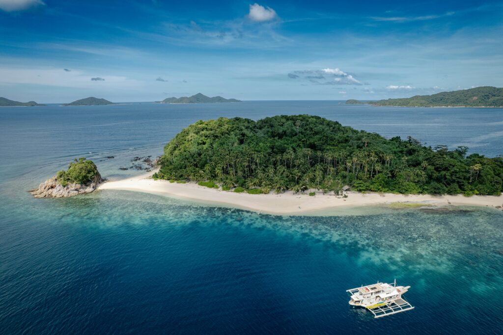 Aerial view of a tropical island coastline in the Philippines