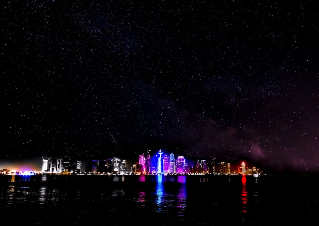 Qatar typhoid risk featured image showing Doha skyline at night