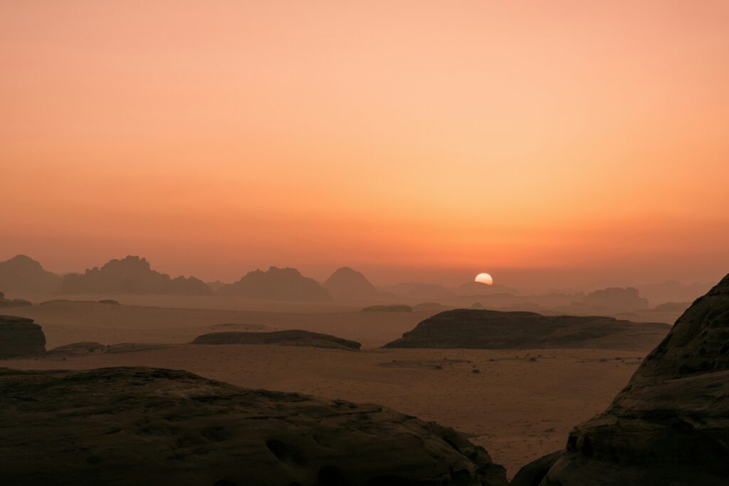 Saudi Arabia travel clinic guide featured image showing desert landscape at sunset