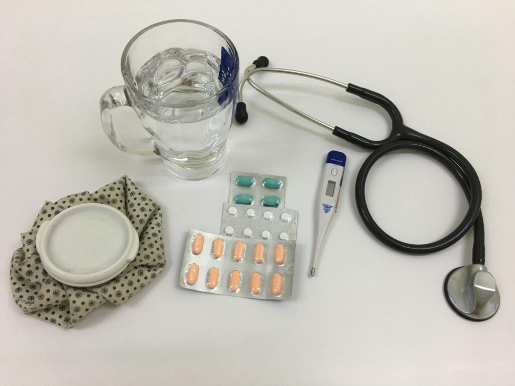 Travel medication kit arranged on a table for trip planning
