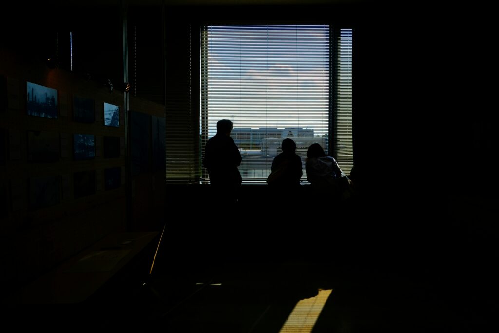 Traveler looking out an airport window before a flight.