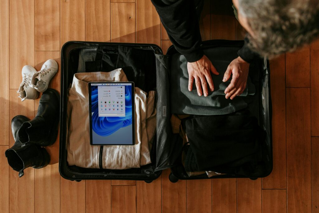 Overhead view of a traveler packing for an international trip