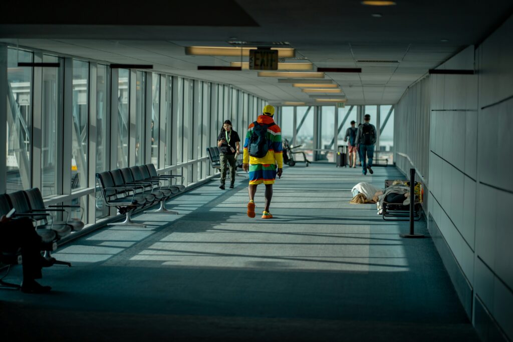 Solo traveler walking through airport terminal for a solo travel health checklist