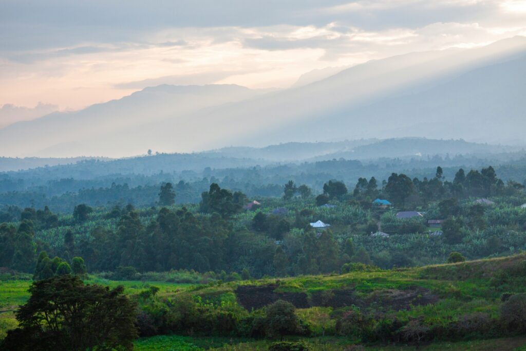 Sunset over the Rwenzori Mountains and a village landscape in Uganda
